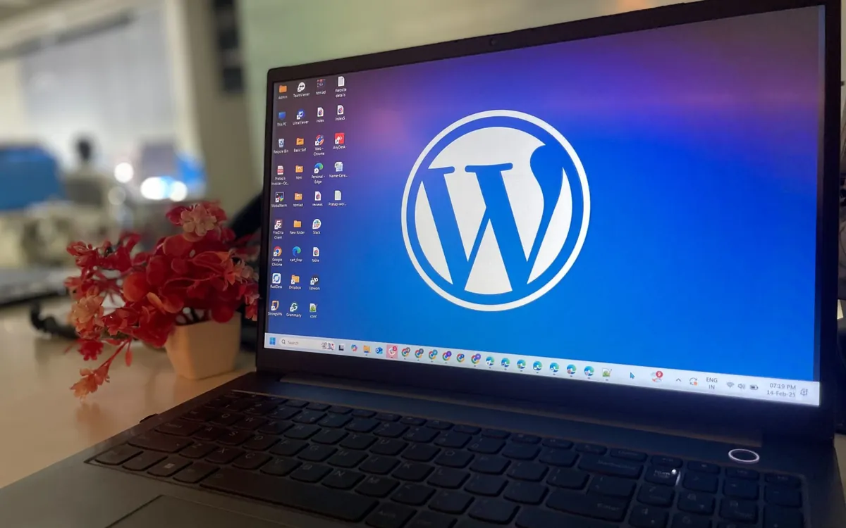 Laptop on a desk showing the WordPress logo