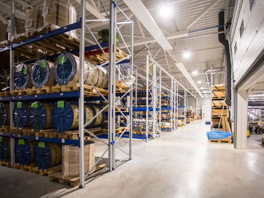 Warehouse aisle of racking stocked with goods