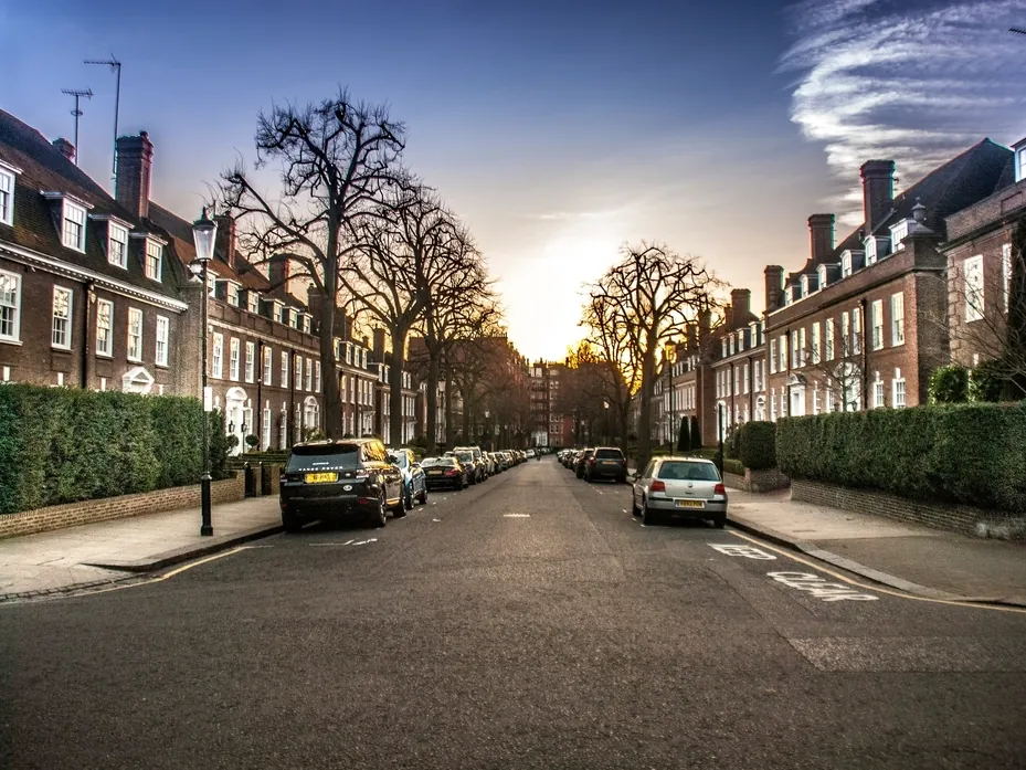 A street of brick terraced houses at sunset
