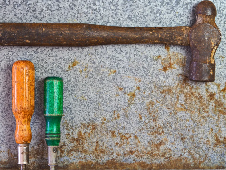 Hammer and screwdrivers on a workbench