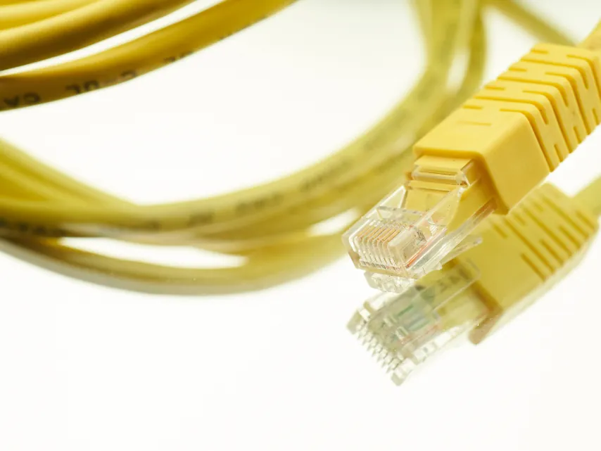 Yellow network cable with its connector