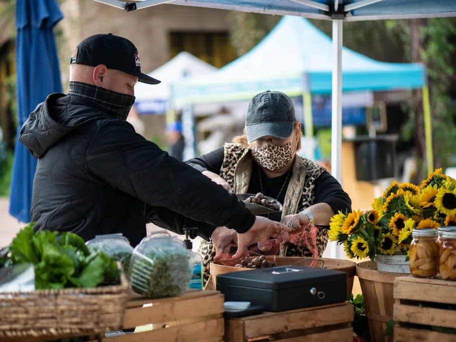 A trader serving at a market stall