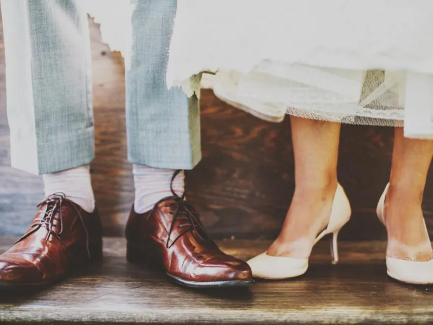 Wedding couple's shoes side by side
